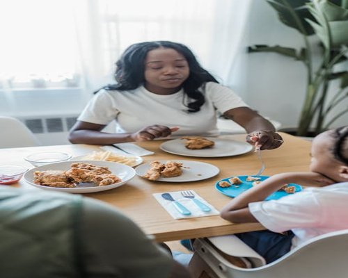 A family eating lunch together at a dining table