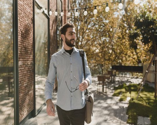 A person taking a short walk break from office work