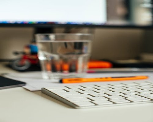 A glass of water on an office desk